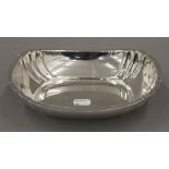 A silver centre bowl. 22 cm long. 328.4 grammes.