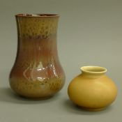 Two Royal Lancastrian pottery vases. The largest 20.5 cm high.