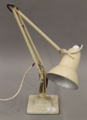 A vintage cream painted anglepoise lamp.