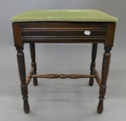 An Art Deco oak standard lamp and a piano stool. The former 150 cm high overall.