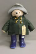 A vintage Paddington Bear, with associated boots. 50 cm high.