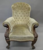 A Victorian mahogany framed upholstered button back open armchair. 73 cm wide.