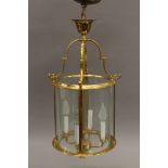 A round gilt lantern. Approximately 65 cm high.