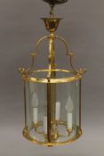 A round gilt lantern. Approximately 65 cm high.