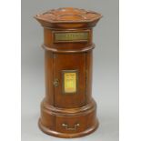 A wooden table top post box. 43 cm high.