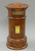 A wooden table top post box. 43 cm high.