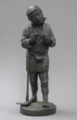 A Japanese bronze model of a farmer. 29.5 cm high.