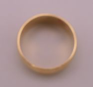 An unmarked gold wedding band, indistinctly inscribed to inner band WENDY 26-???. Ring size L/M. 6.