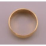 An unmarked gold wedding band, indistinctly inscribed to inner band WENDY 26-???. Ring size L/M. 6.