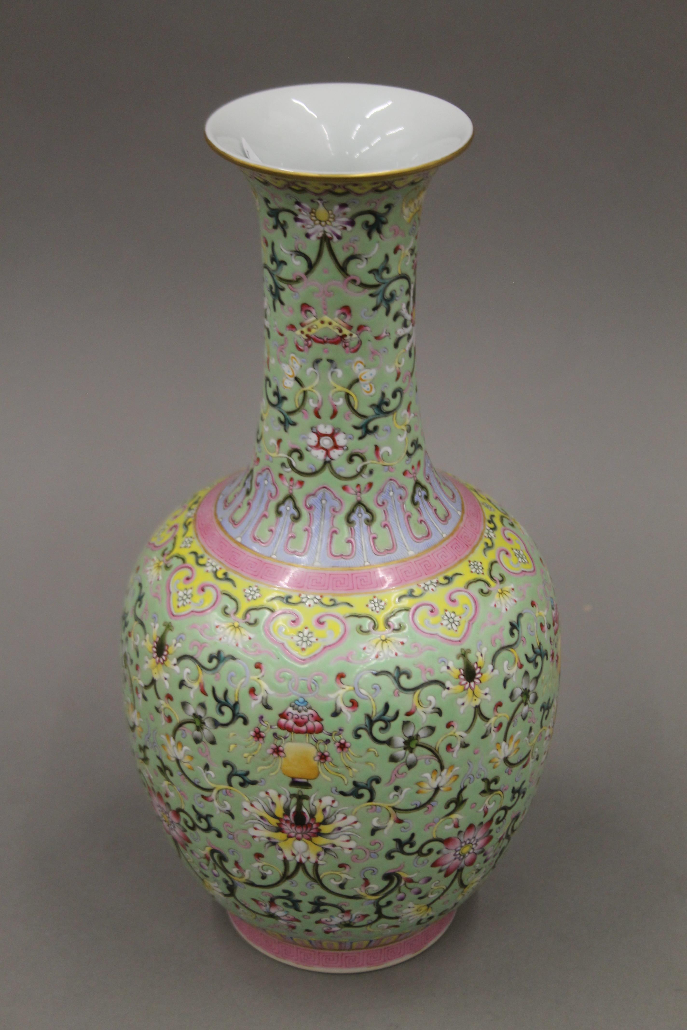 A Chinese green ground porcelain vase with scrolling foliate decoration, - Image 2 of 9