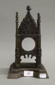 A Victorian Gothic Revival cast iron pocket watch stand. 28.5 cm high.