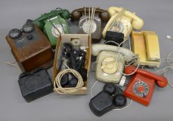 A box of vintage telephones.