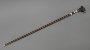 A walking stick, the handle formed as a pheasant head. 92 cm long.