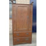 In the Manner of Heals, an Arts and Crafts oak compactum wardrobe. 199.5 cm high x 95 cm wide.