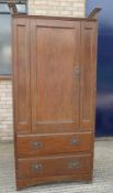 In the Manner of Heals, an Arts and Crafts oak compactum wardrobe. 199.5 cm high x 95 cm wide.