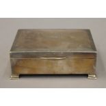 A silver cigarette box. 13 cm wide. 305.7 grammes total weight.