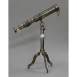 A small telescope on stand. 25 cm long.