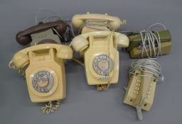 A box of vintage telephones.