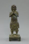 A Chinese bronze attendant figure. 27.5 cm high.