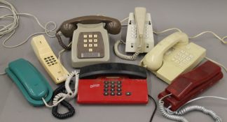 A box of vintage telephones.