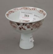 A Chinese porcelain stem cup. 9 cm high.