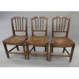Three 19th century elm solid seated Country chairs.