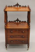 A Victorian mahogany whatnot with cellarette drawer. 102 cm high.