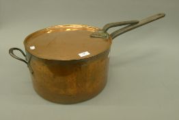 A large Victorian copper saucepan and lid. 36.5 cm diameter.