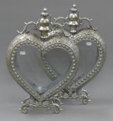 A pair of heart shaped lanterns. 52 cm high.