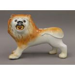 A Sadler pottery lion. 32.5 cm long.