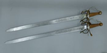 A pair of Spanish Toledo wall swords. 99 cm high.