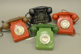 A box of vintage telephones.