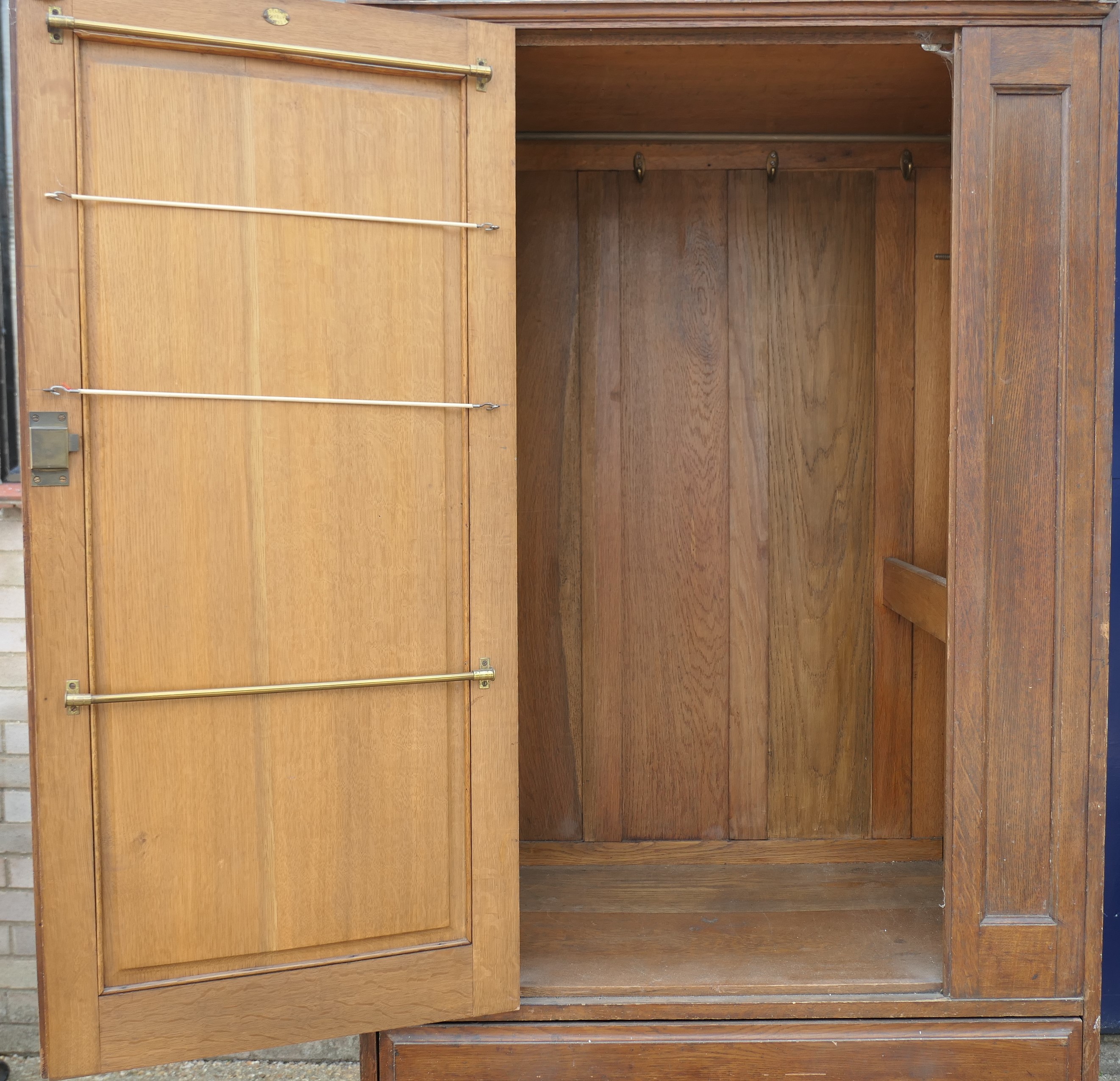 In the Manner of Heals, an Arts and Crafts oak compactum wardrobe. 199.5 cm high x 95 cm wide. - Image 4 of 11