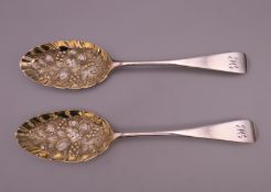 A pair of Georgian embossed silver berry spoons. 20.5 cm long. 126.2 grammes.