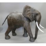 A large leather clad model of an elephant. 128 cm high x 140 cm long.