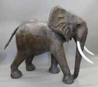 A large leather clad model of an elephant. 128 cm high x 140 cm long.