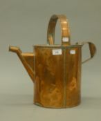 An antique copper watering can. 40 cm high.