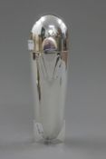 A silver plated cocktail shaker formed as a zeppelin. 23.5 cm high.