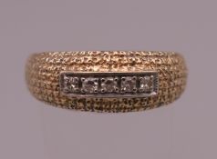 A 14 K gold five stone diamond ring. Ring size T/U. 5.1 grammes total weight.