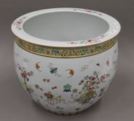 A Chinese porcelain fish bowl painted with bats, flowers and precious objects, heightened in gilt.