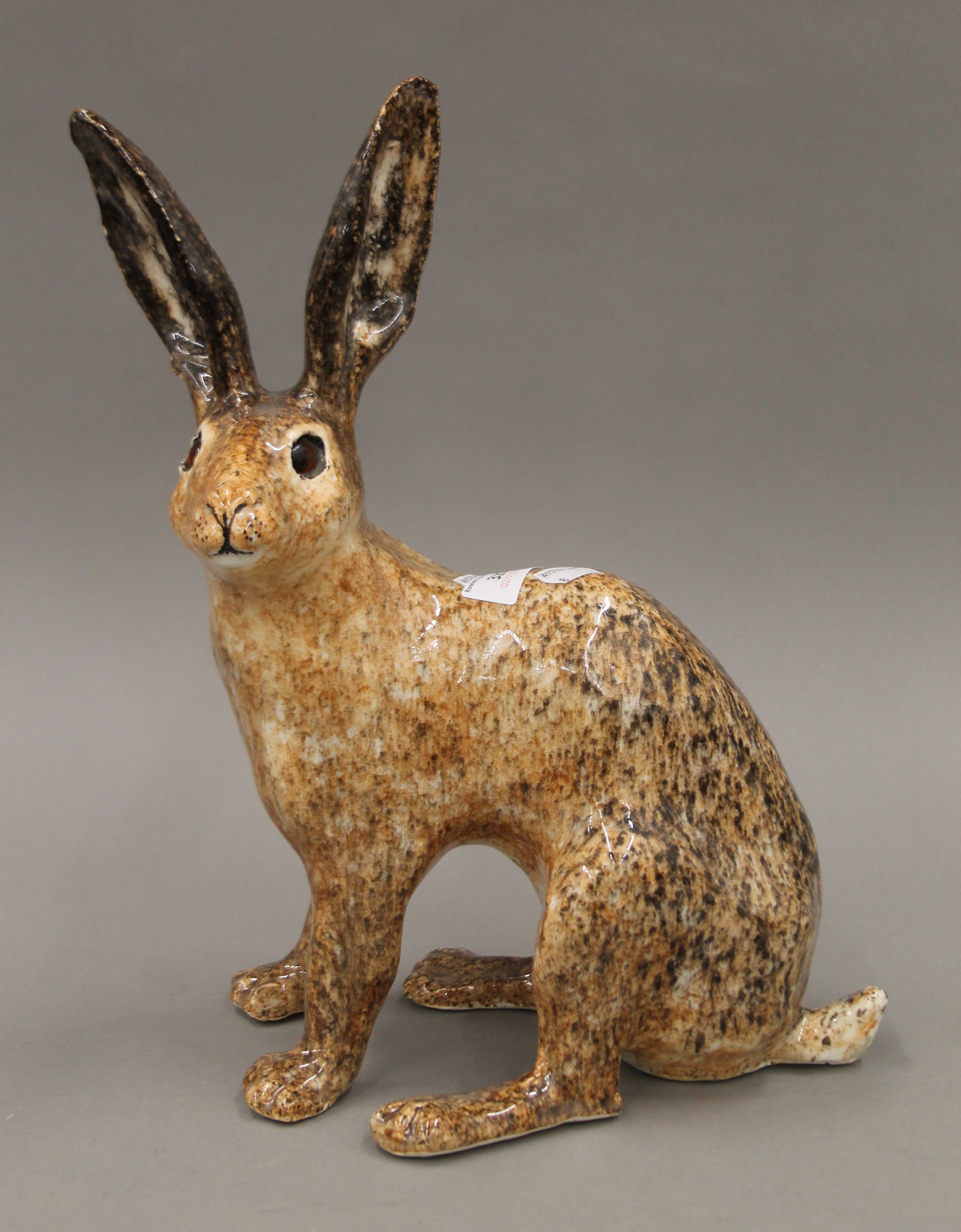 A Winstanley porcelain model of a hare. 38 cm high.