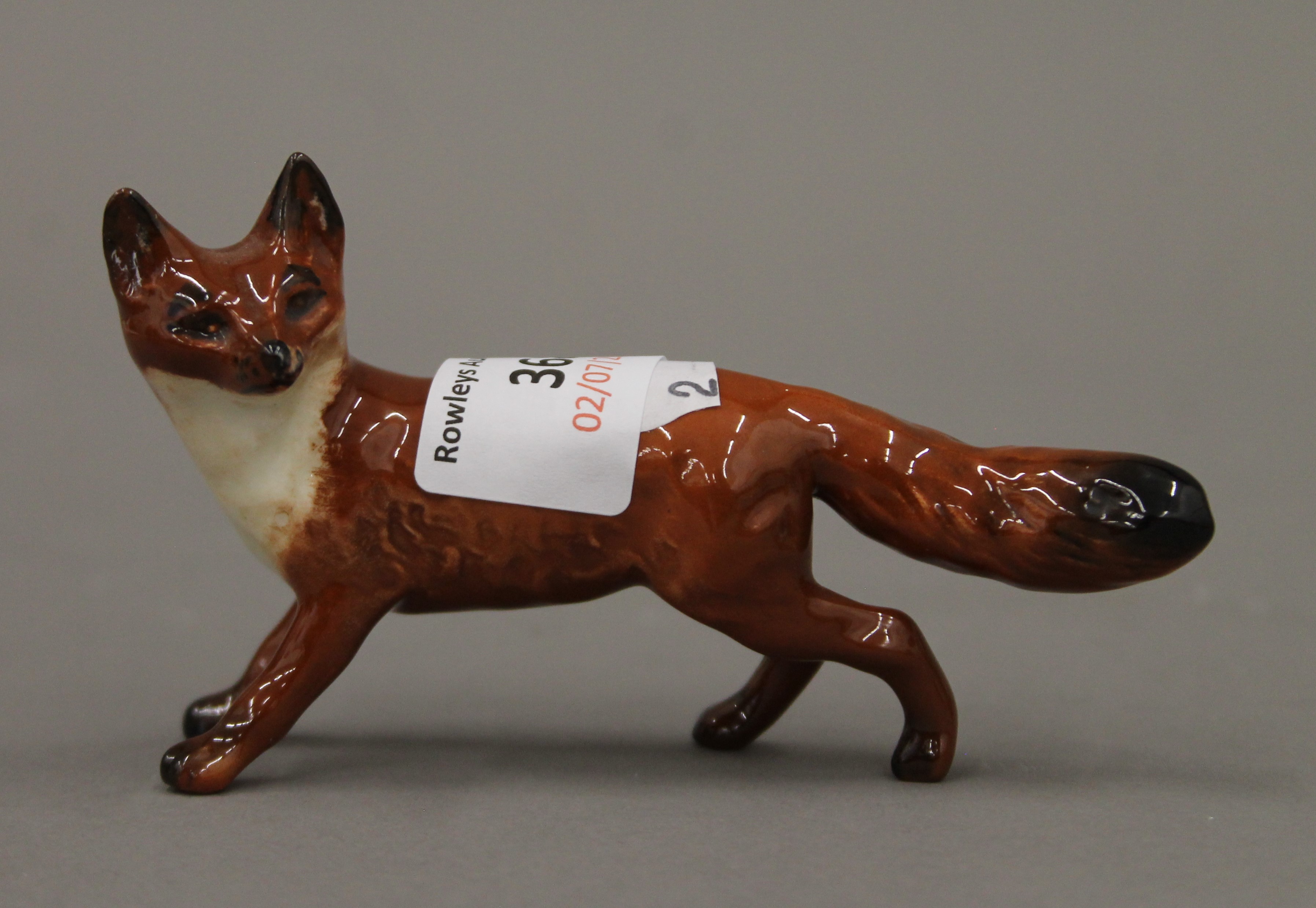 Two Beswick foxes, a pug dog, a wren and a Doulton dog. - Image 4 of 6