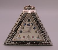A silver Masonic type pocket watch. 5 cm high.