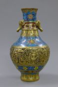 A cloisonne and bronze vase with elephant mask handles. 25.5 cm high.