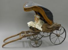 A doll and cart.