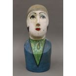 MOLLY MOSS, a painted female bust, signed to the underside and numbered 5. 42 cm high.