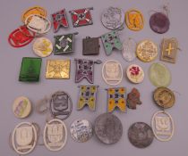A quantity of Nazi Winter Relief badges.