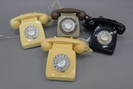 A box of vintage telephones.