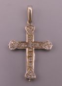 An 18 ct white gold diamond set cross pendant. 2.5 cm high excluding suspension loop. 2.