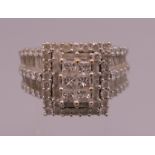 A 14 K white gold diamond ring. Ring size S/T. 12.6 grammes total weight.